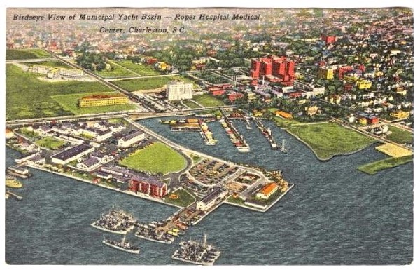 The Municipal Yacht Basin (center) is now Alberta Long Lake. The West Point Mill housed the US Atlantic Fleet Mine Force during the 1950s. Roper Hospital can be seen across Calhoun Street from the yacht basin, flanked by the Tuberculosis Sanitarium on the left and the medical school complex (large red group of buildings) on the right. Postcard from the 1950s retrieved at delcamp.net.